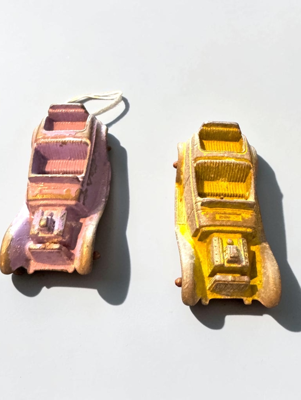 Pair of Vintage Early 20th Century Toosie Cast Metal Toy Cars in Pink and Yellow
